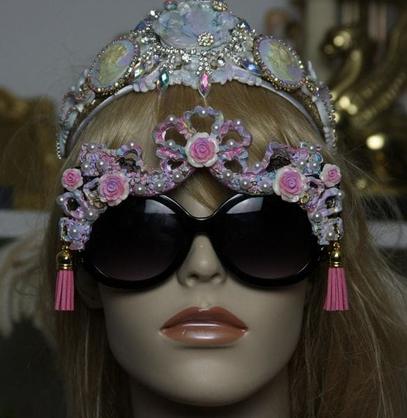 A mannequin wearing sunglasses and a tiara.