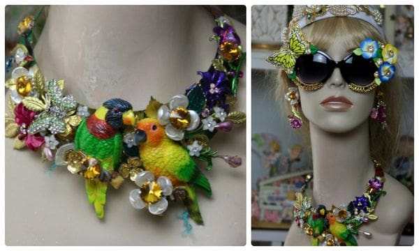 A woman wearing sunglasses and a necklace with flowers.