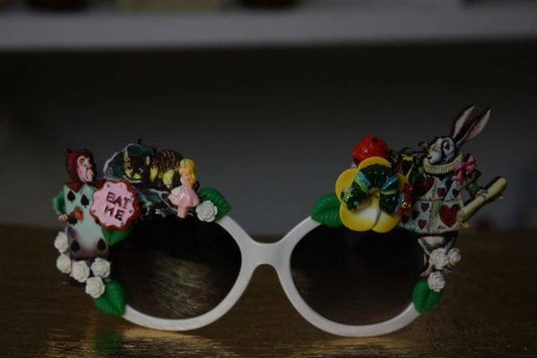 A pair of sunglasses with flowers on them.