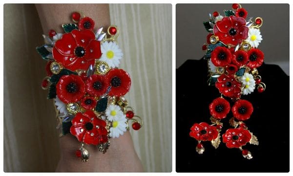 A bracelet with red flowers and white daisies.
