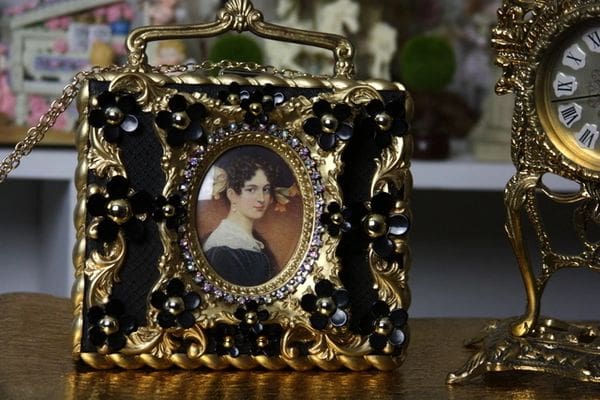A picture of a woman in a frame on top of a table.