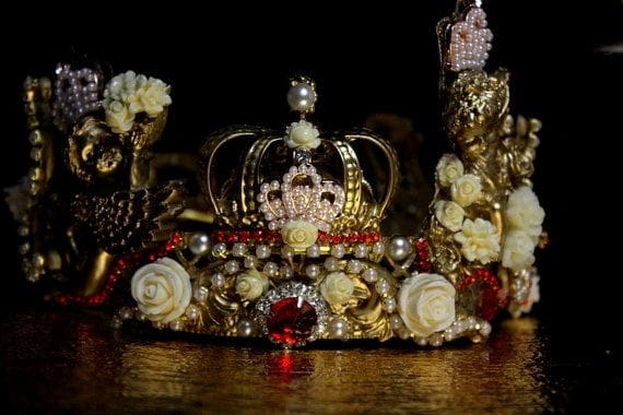 A crown made of gold and white flowers.