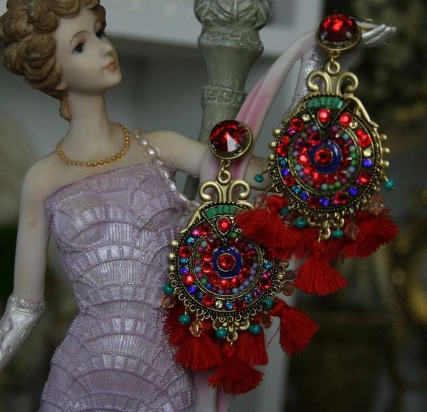A woman in a dress and earrings