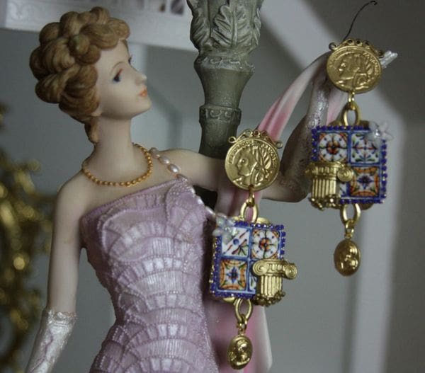 A figurine of a woman in a pink dress.