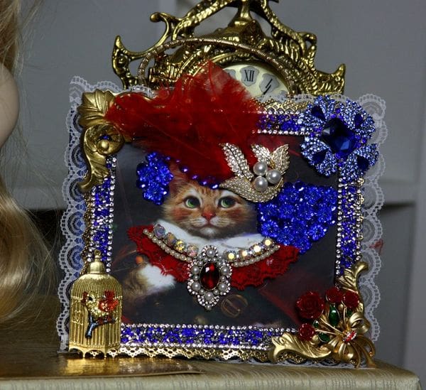 A cat is wearing a red, white and blue outfit.
