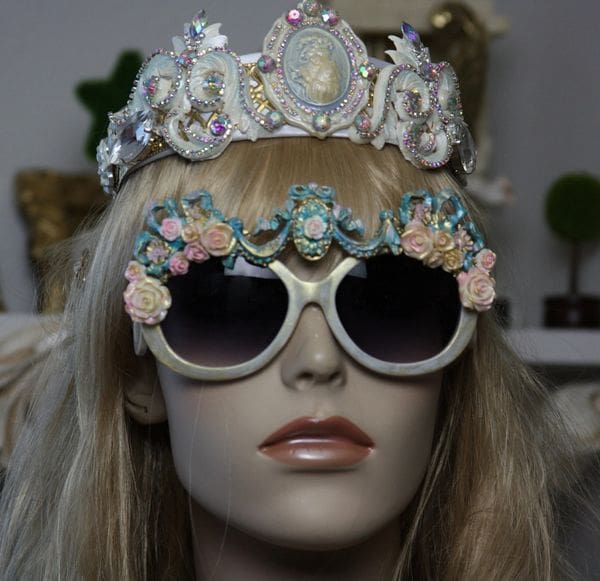 A mannequin wearing sunglasses and a tiara.