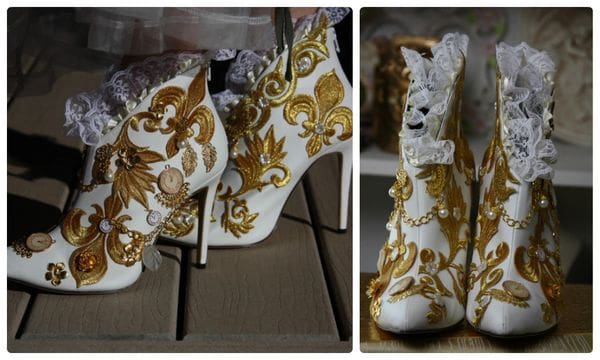 A pair of white and gold boots with animal print.