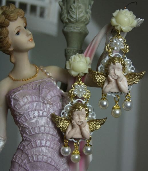 A statue of a woman in a dress and earrings.