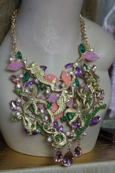 A necklace with leaves and flowers on it