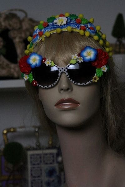 A mannequin wearing sunglasses and a flower crown.