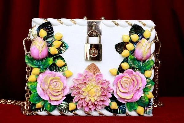 A white box with pink and yellow flowers on it.