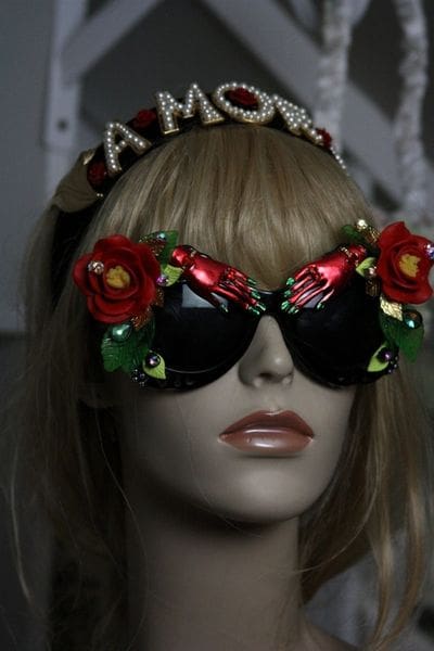 A mannequin wearing sunglasses with flowers on them.
