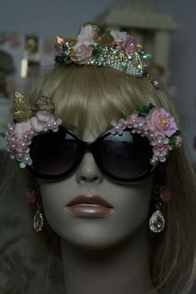 A mannequin wearing sunglasses and a tiara.