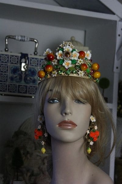 A mannequin wearing a tiara and earrings.