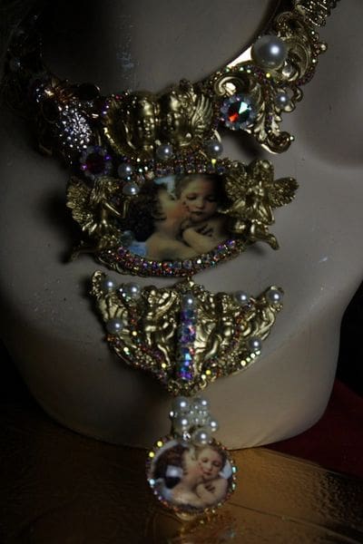 A woman 's neck with some jewelry on it