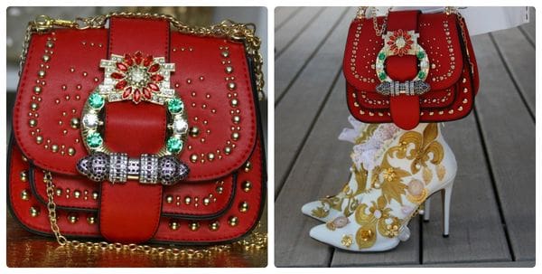 A red purse with gold studs and a golden chain.