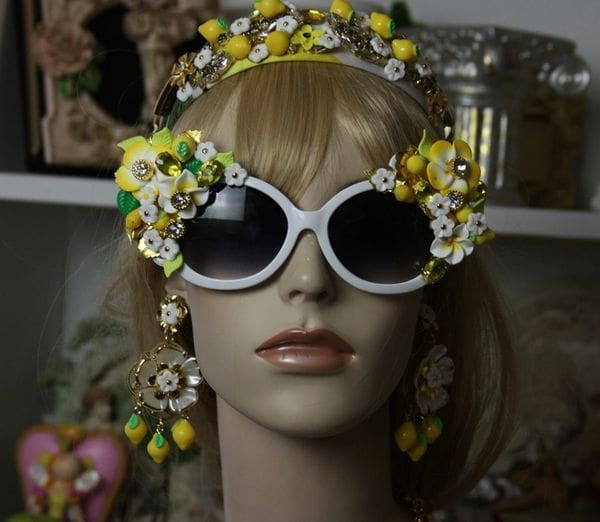 A mannequin wearing sunglasses and a headband.