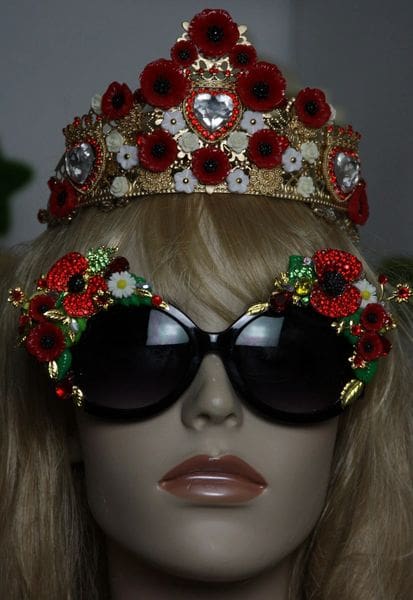 A mannequin wearing sunglasses and a crown.