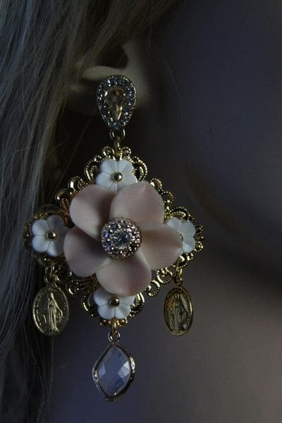 A close up of a woman wearing earrings