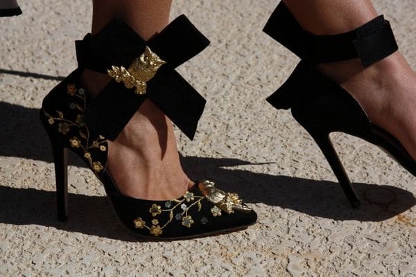 A close up of the feet and shoes of a woman.