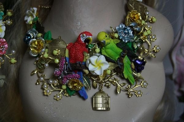 A necklace with many different colored birds and flowers.