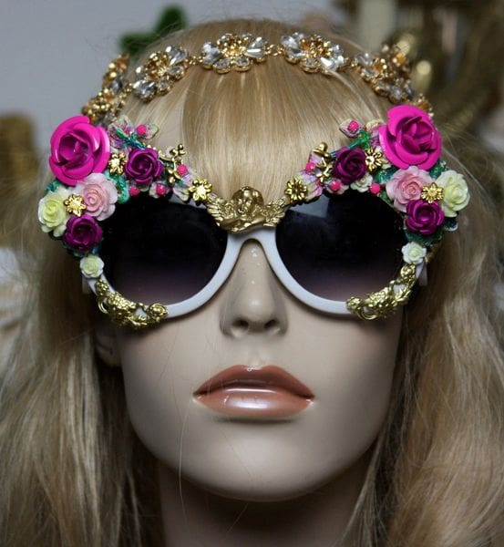 A mannequin wearing sunglasses with flowers on them.