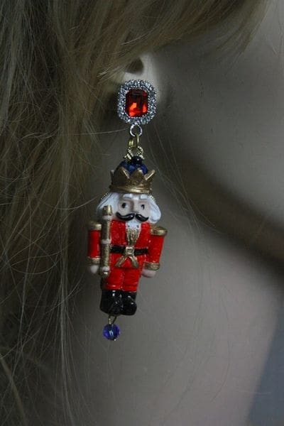 A close up of a person wearing earrings