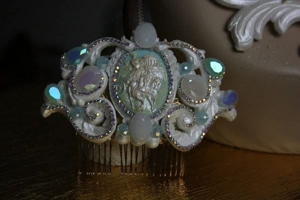 A white and blue hair comb with lights on it.