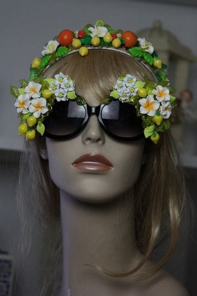 A mannequin wearing sunglasses and a flower crown.