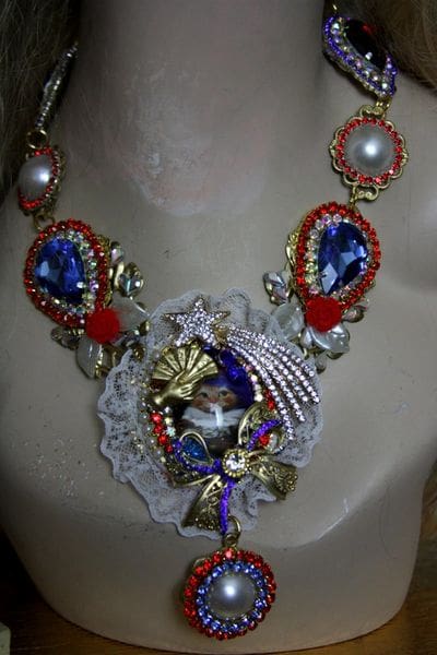 A woman wearing a necklace with red and blue beads.