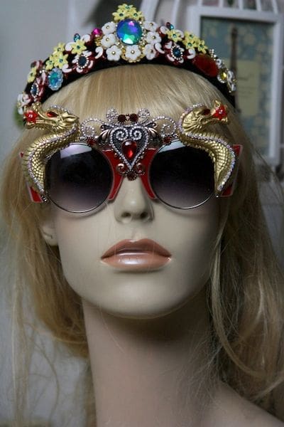 A mannequin wearing sunglasses and a headband.
