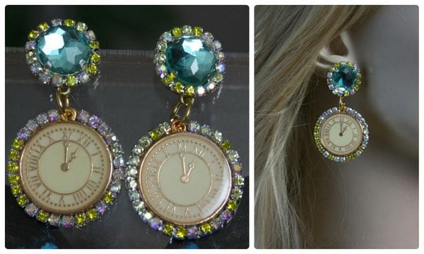 A woman wearing earrings with a clock on them.