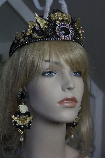 A mannequin wearing a crown and earrings.