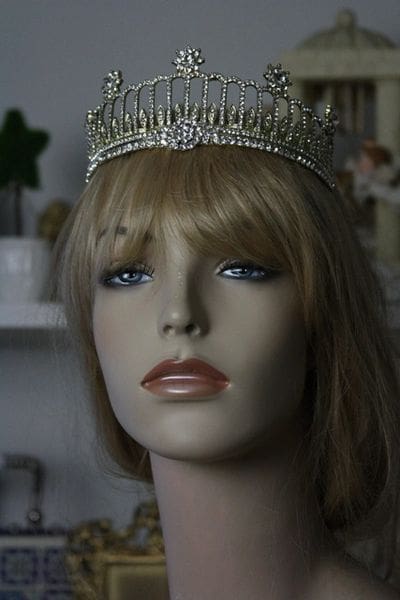 A mannequin head with a tiara on it