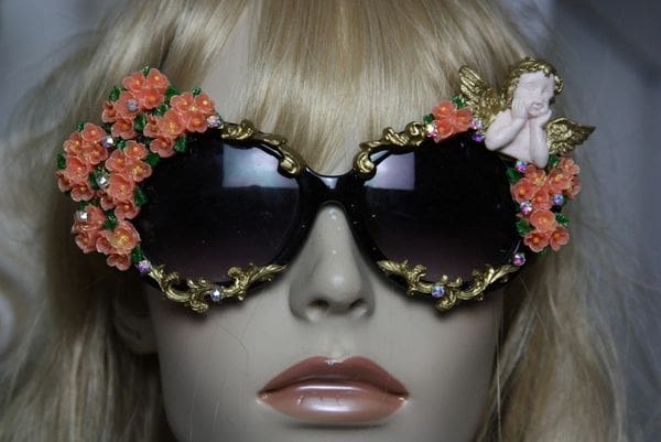 A mannequin wearing sunglasses with flowers on them.