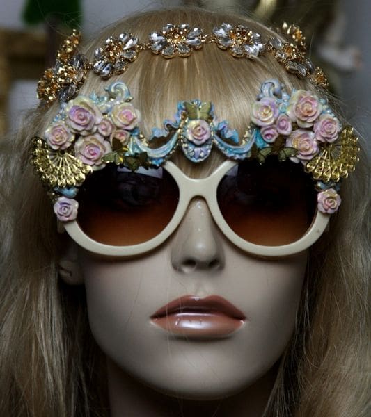A mannequin wearing sunglasses with flowers on them.