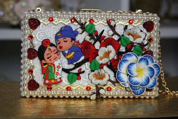 A close up of the front of a purse