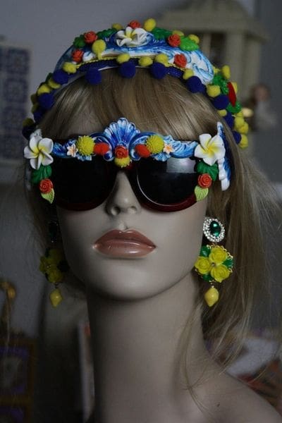 A mannequin wearing sunglasses and a headband.
