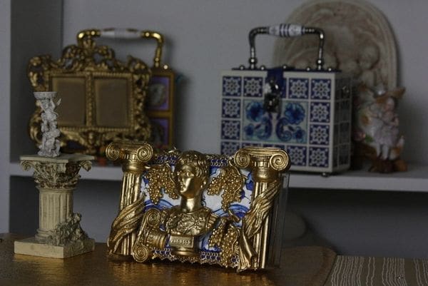 A table with two different types of purses on it.