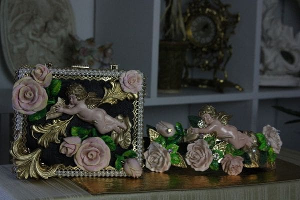 A picture frame with pink roses and gold leaves.