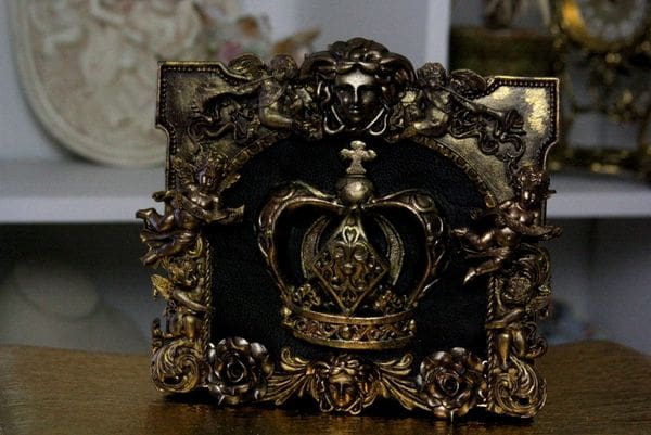 A picture frame with a crown on it