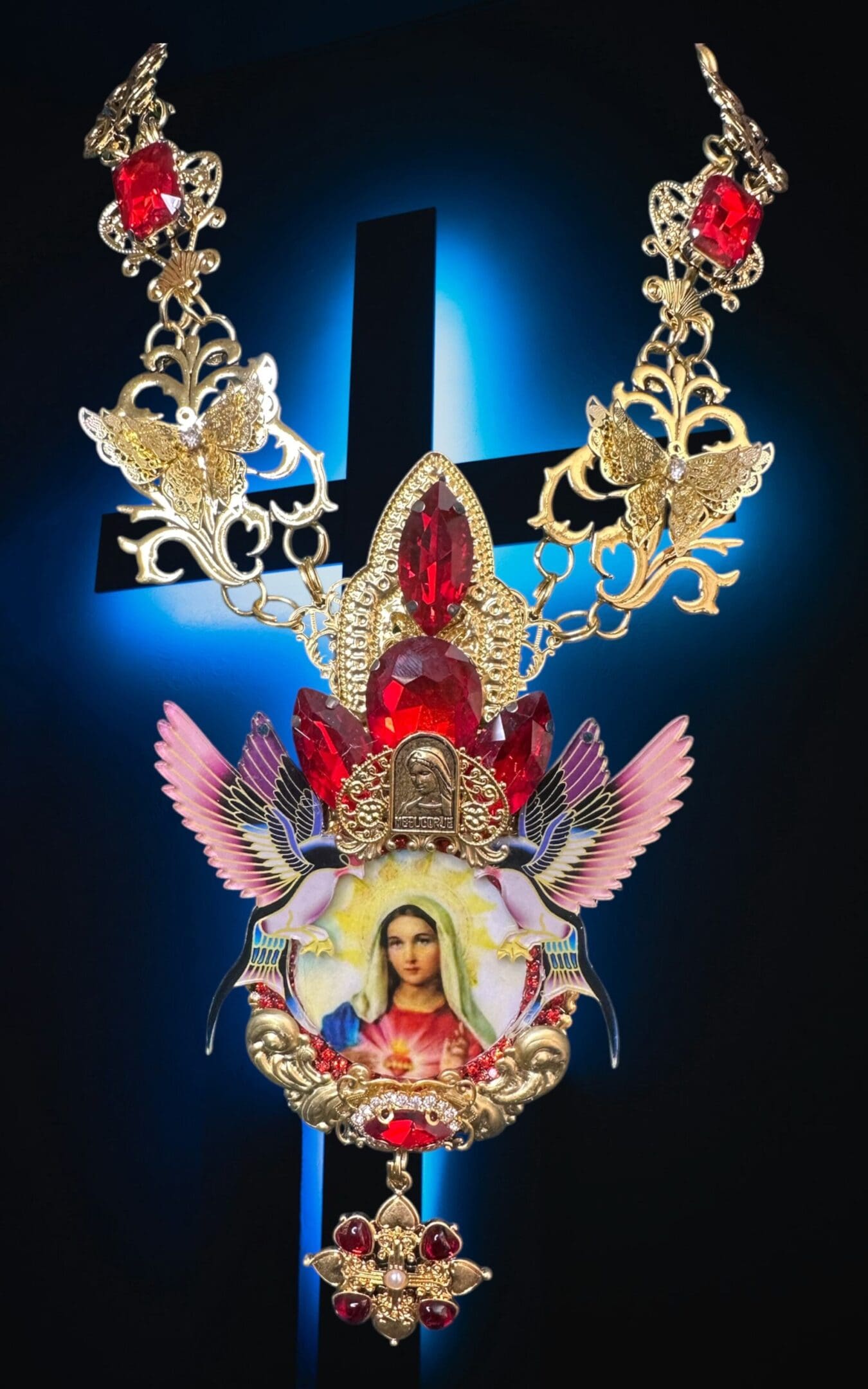 A necklace with an image of the virgin mary.