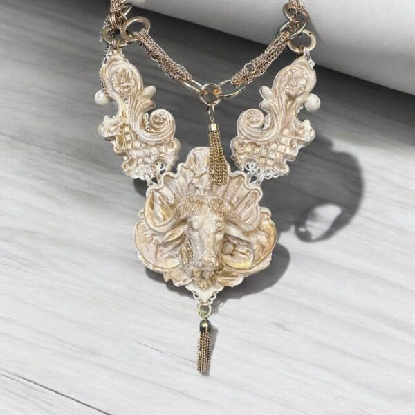 A necklace with an ornate design on it.