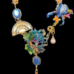 A necklace with a mask and flowers on it