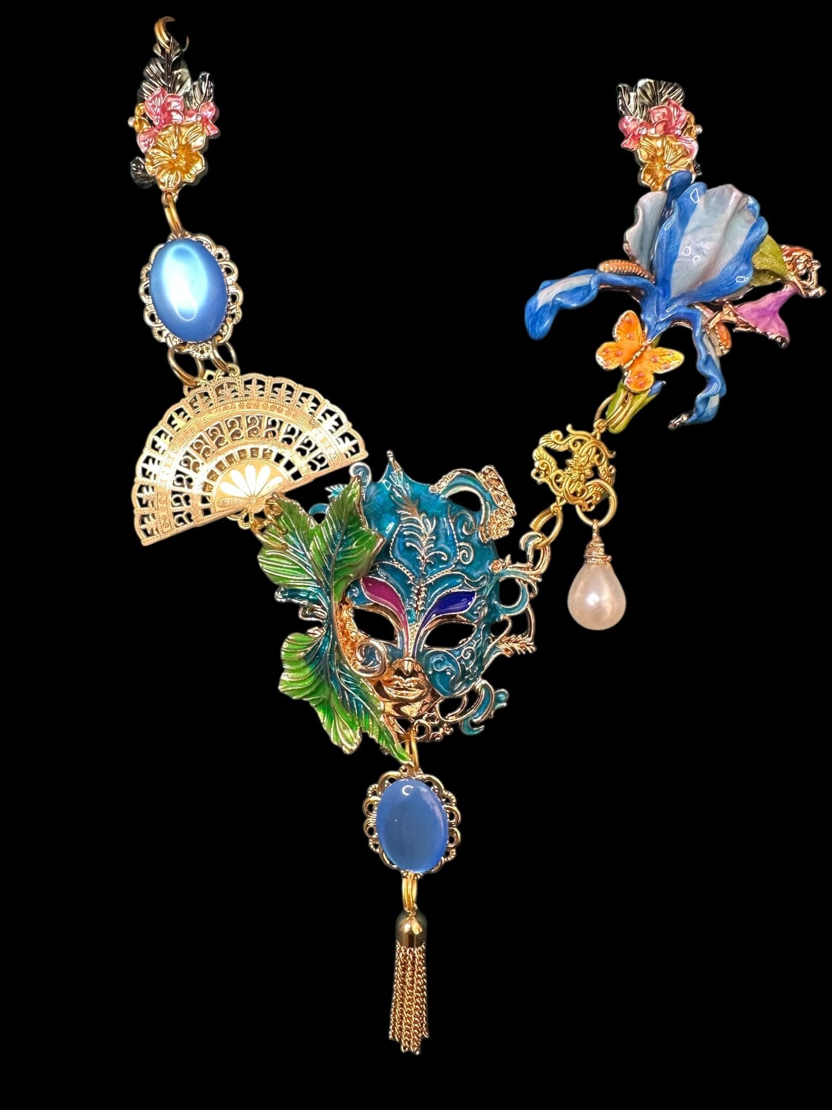A necklace with a mask and flowers on it
