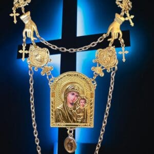 A cross with a chain hanging from it.