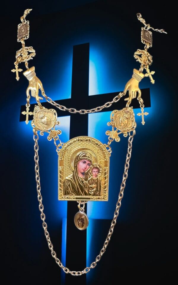 A cross with a chain hanging from it.