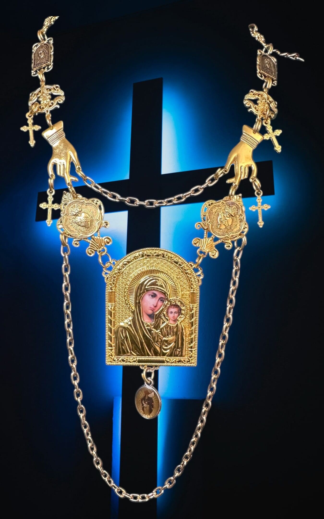 A cross with a chain hanging from it.