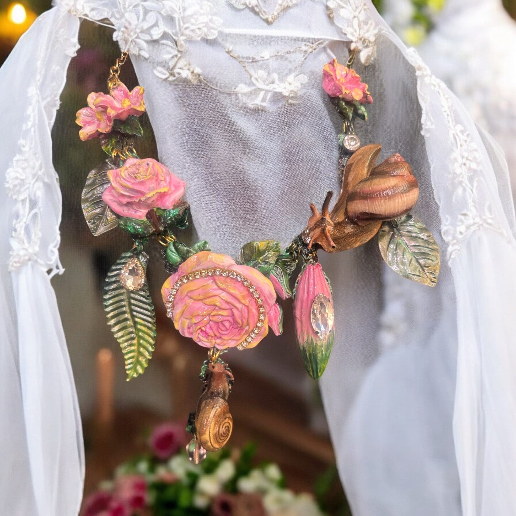 A necklace of flowers and leaves is displayed.