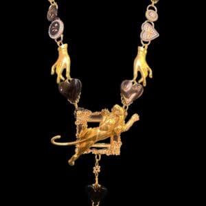 A necklace with gold lion and other animal designs.